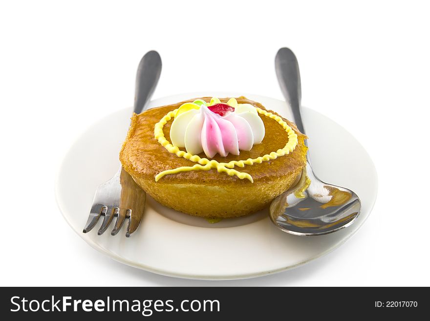 Cup cake and fork on white background