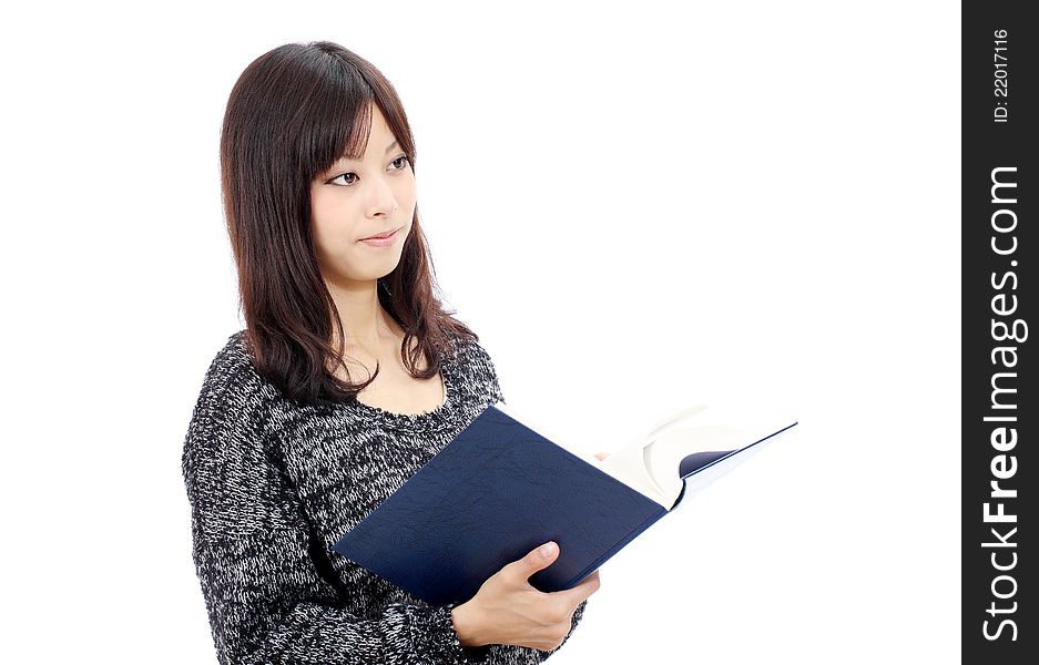 Portrait of young asian woman reading book