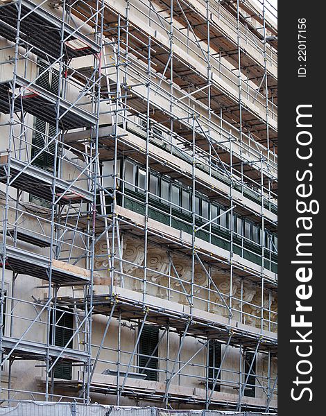 Maltese building under renovation with scaffolding