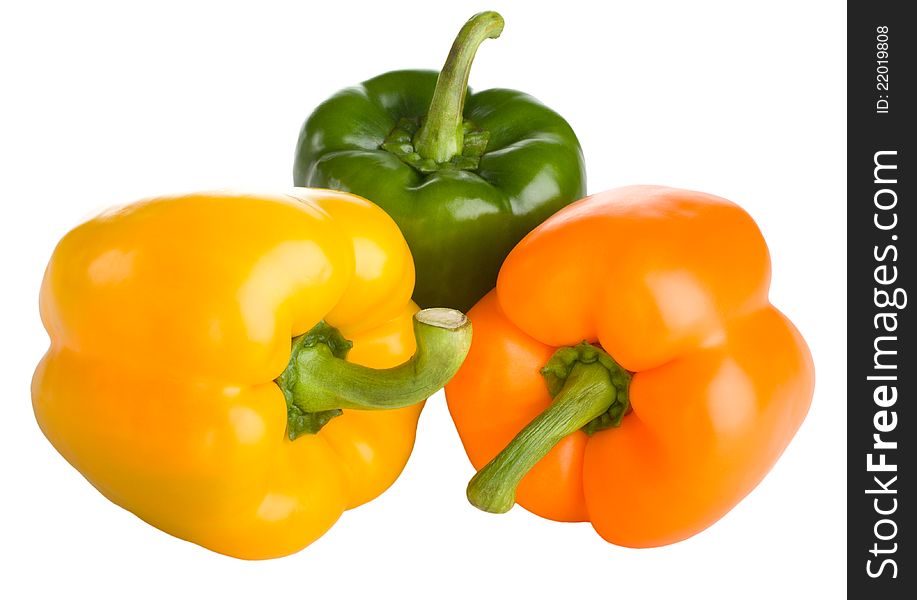 Yellow, orange and green bell peppers isolated on white background. Yellow, orange and green bell peppers isolated on white background