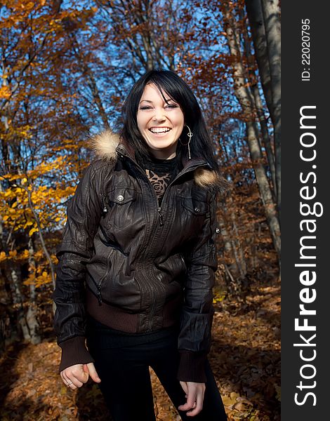 Smiling young woman in autumn forest. Smiling young woman in autumn forest