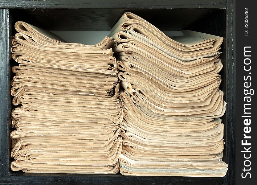 A Stack Of Old Newspapers.