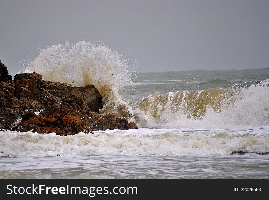 Storm on the rainy day. Waves lifting sand from the bottom. Storm on the rainy day. Waves lifting sand from the bottom.