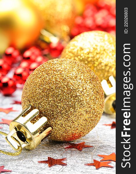 Golden Christmas balls on the festive background