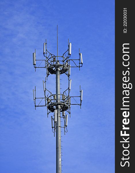 Signal tower of mobile phone on blue sky