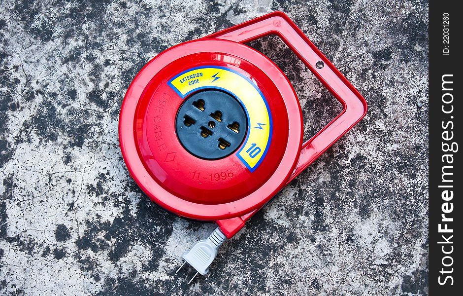 Cartridge roll of wire. Placed on a cement floor.