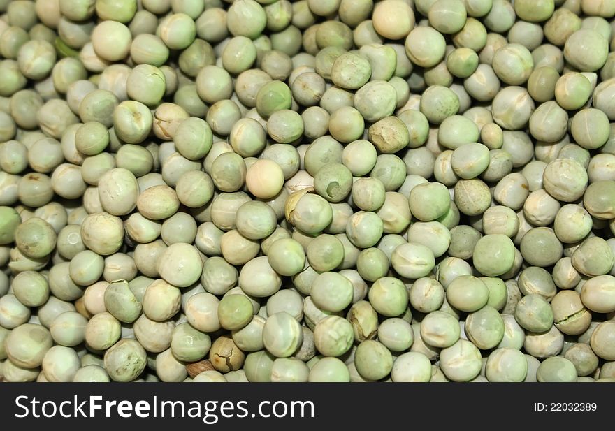 Dried uncooked green peas background