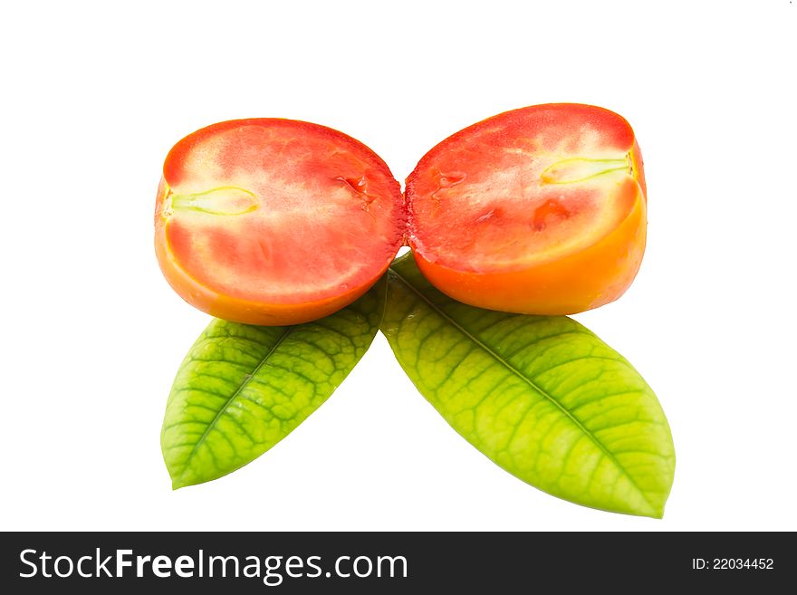 Tomato on beautiful green leaf. Tomato on beautiful green leaf