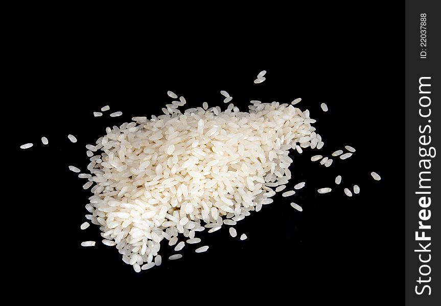 Stack of rice on black background