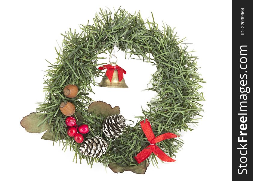 Christmas wreath decoration with bell, cones and nuts