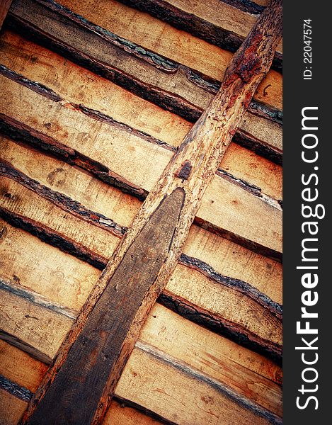 The sawn wooden boards. Wooden texture in grunge background. The sawn wooden boards. Wooden texture in grunge background