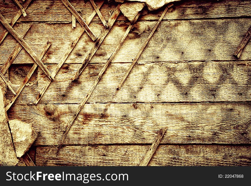 The destroyed old wall. Wooden texture in grunge background. The destroyed old wall. Wooden texture in grunge background