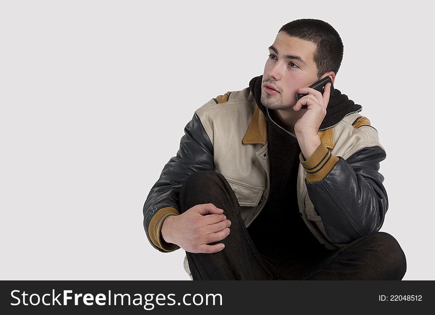 Handsome young man talking on mobile phone