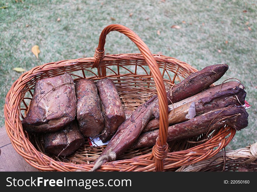 Pieces of pastrami in straw basket