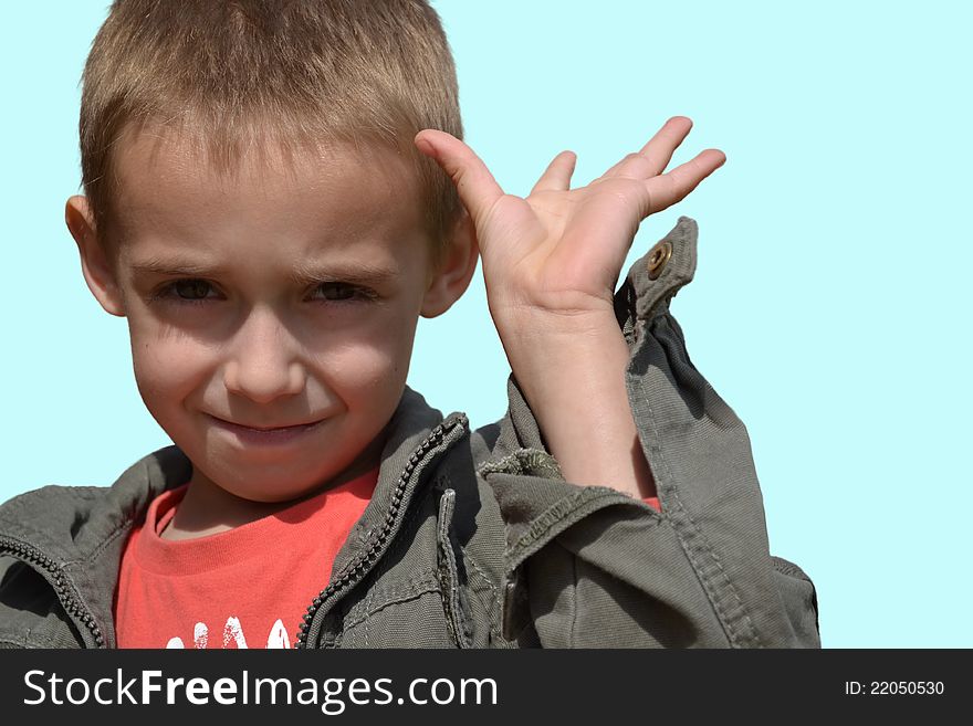 Happy little boy with a smiling expression showing fingers. Happy little boy with a smiling expression showing fingers