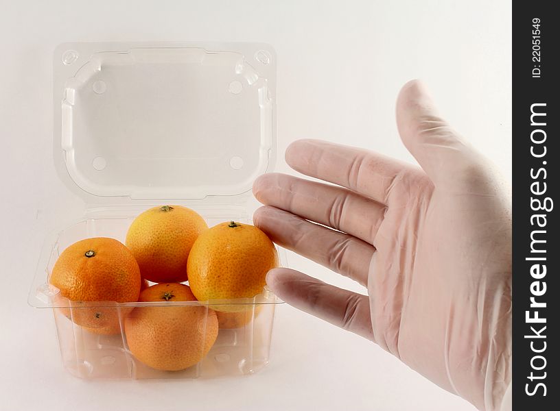 Mandarin hand man takes from food packaging.