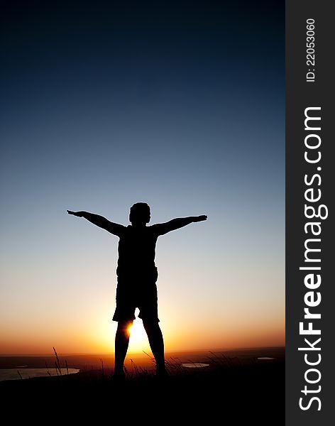 Silhouette of a child against the setting sun. Silhouette of a child against the setting sun