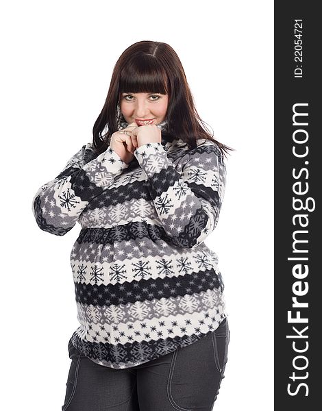 Beautiful dark haired pregnant womanholding the collar of her cozy warm sweater with winter pattern. Beautiful dark haired pregnant womanholding the collar of her cozy warm sweater with winter pattern