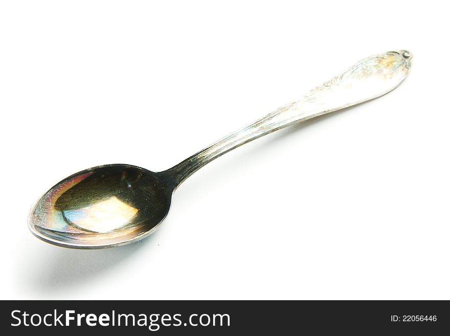 Old silver patina teaspoon  on white background