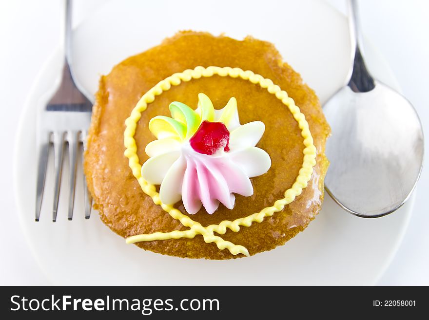 Closeup Cup cake and fork on white background