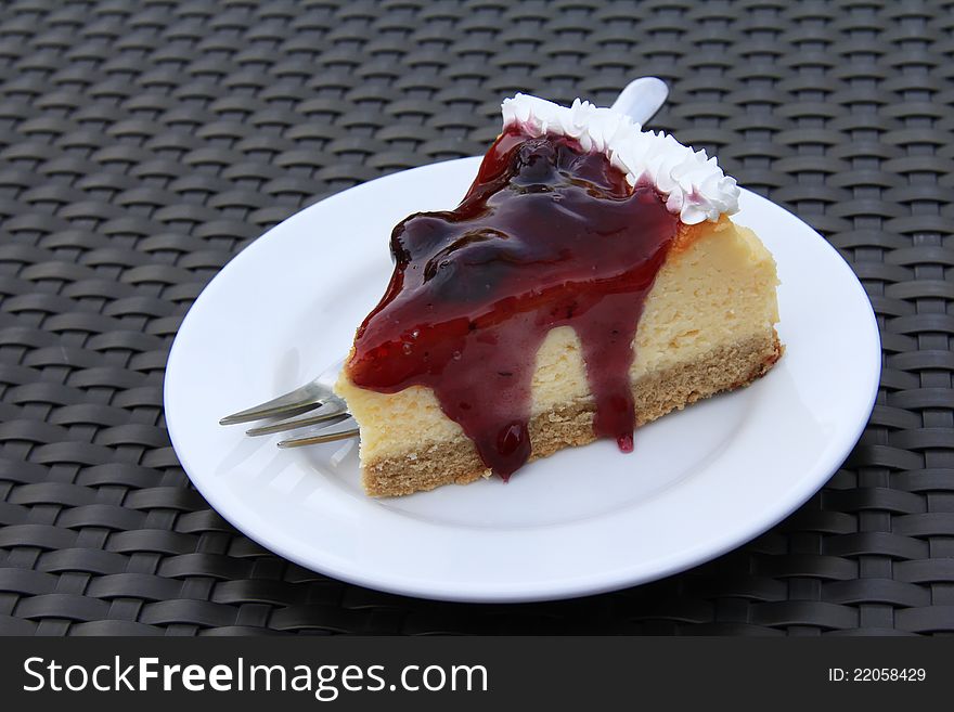 A piece of delicious blueberry cheesecake on a plate