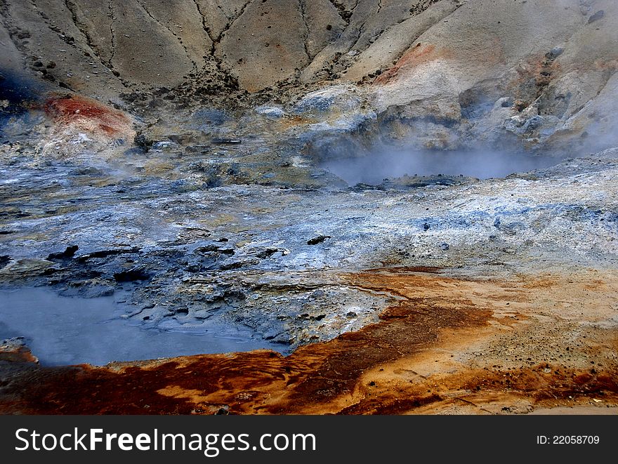Gorgeous colors of earth and stone surrounding geysers in Iceland. Gorgeous colors of earth and stone surrounding geysers in Iceland