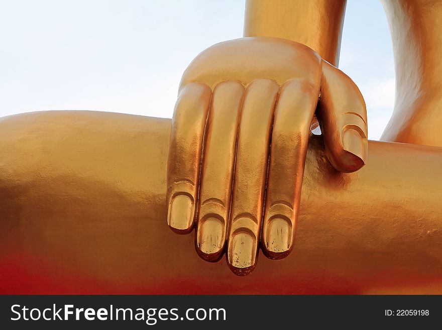 Hand of the Big Golden Buddha with gold flake in Pattaya, Thailand