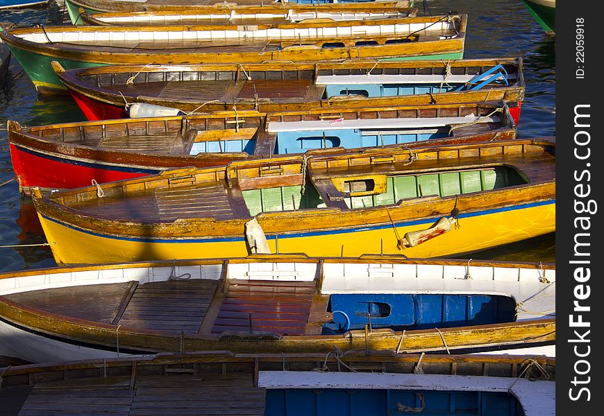 A set of boats docked in tourist harbor of Naples. A set of boats docked in tourist harbor of Naples