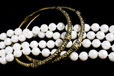 Brass Bracelets And Fashion Pearls On Black Stock Photo Brass Bracelets And Fashion Pearls On Black Stock Photo
