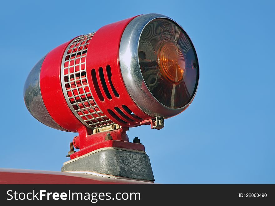 Detail of a Red siren over a firefighters vehicle