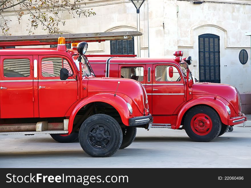 Old red firemen trucks in an exhibition. Old red firemen trucks in an exhibition