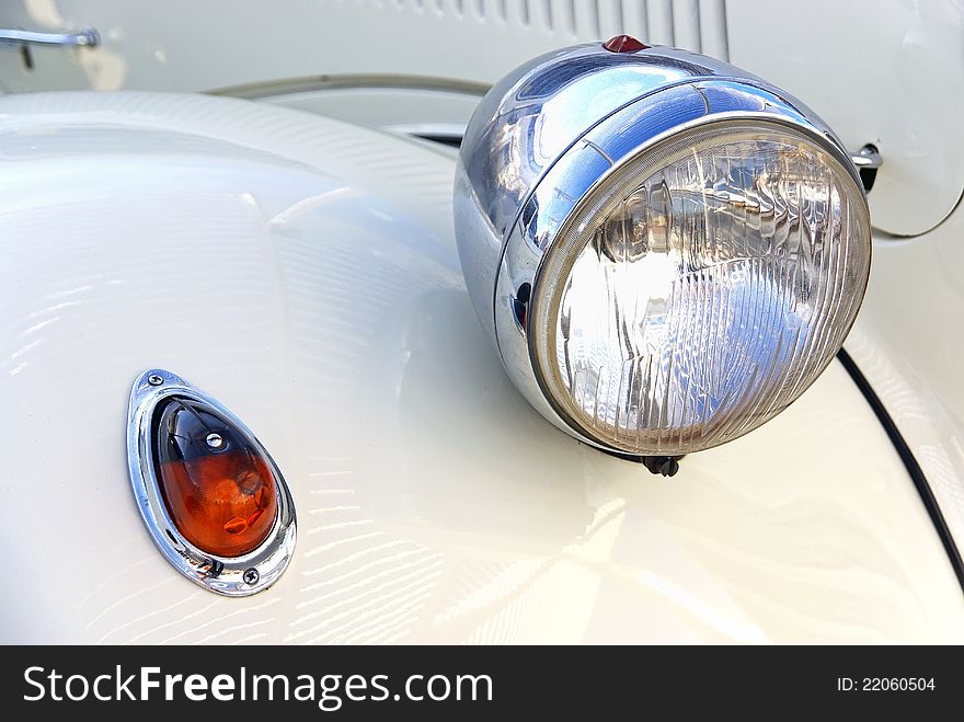 Details of the headlights of a Classical White Car