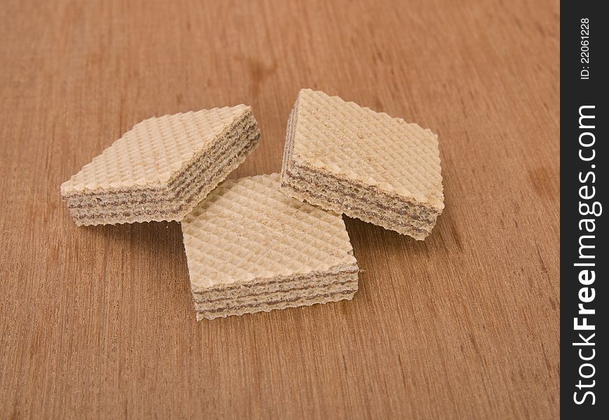 Chocolate wafer stacked and shot in the studio on wooden background