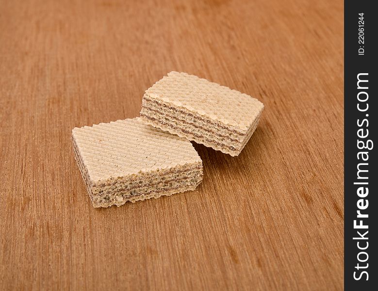 Chocolate wafer stacked and shot in the studio on wooden background