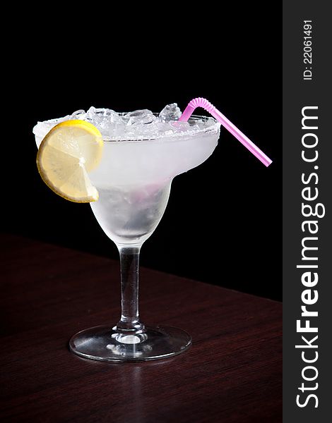 Margarita cocktail on ice with lemon slice