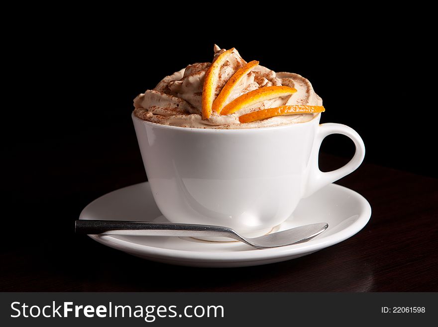 Coffee cup with cream and cinnamon. Coffee cup with cream and cinnamon