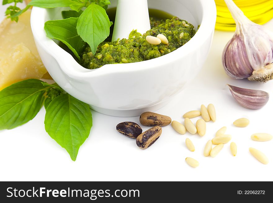 Fresh Italian Pesto and its ingredients / isolated on white