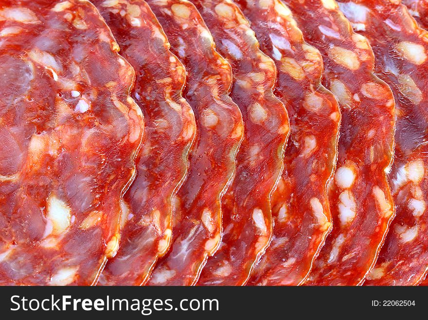 Closeup photo of fresh spicy Spanish chorizo (sausage) - Salami / Pepperoni