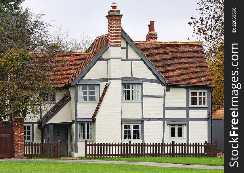 Traditional Timber Framed English Village Cottage with picket fence