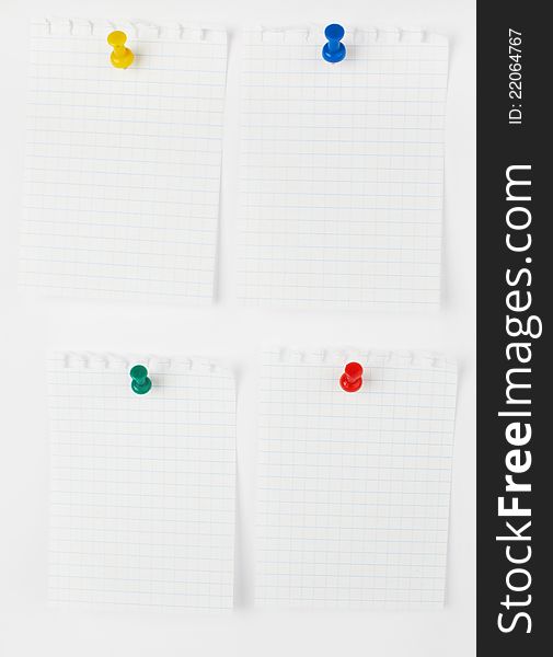 Collection of note papers with push pins on white background. each one is shot separately