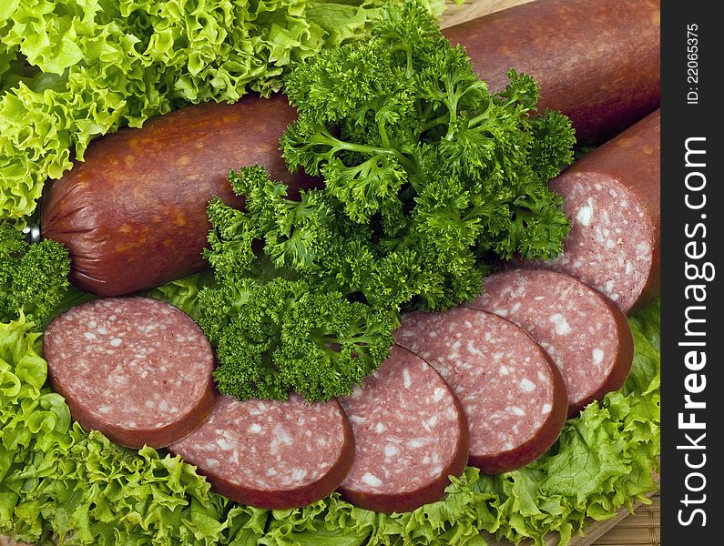 Sausage with parsley and lettuce