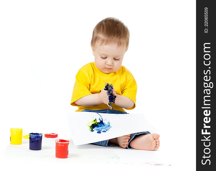 Adorable dirty child with paints