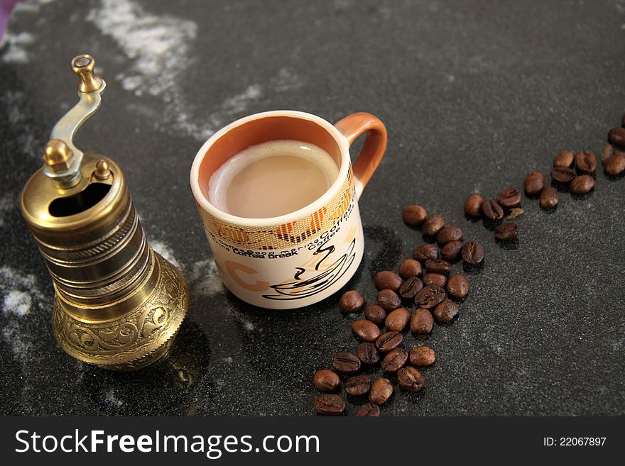 Coffee beans and coffee grinder, antique metal