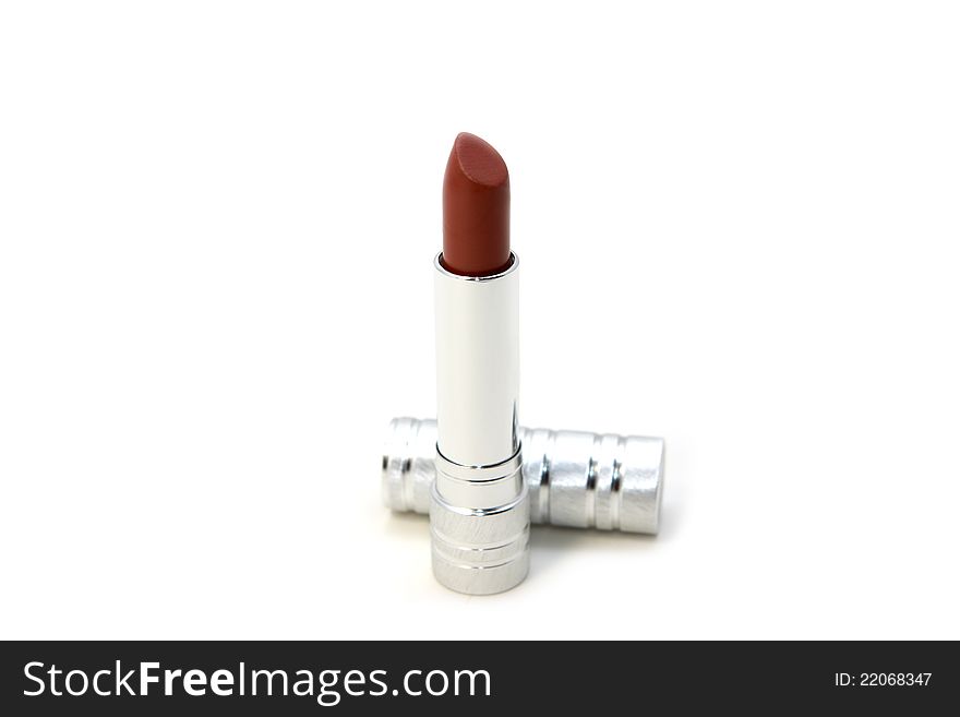 Red lipstick with silver corpus over white