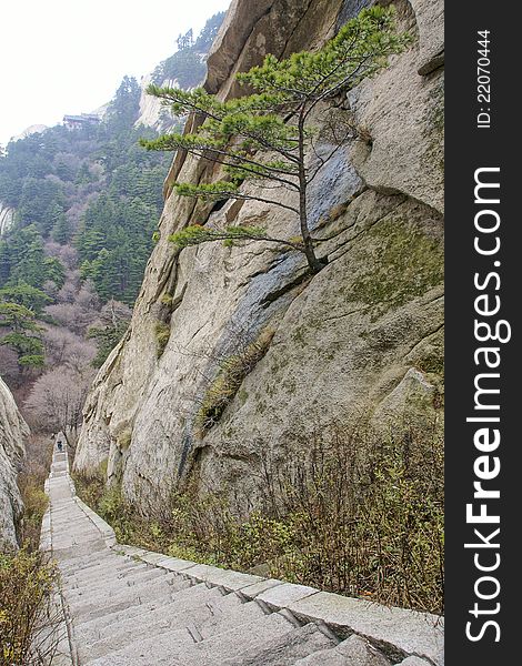 The dangerous way in Mount Hua(Huashan). Huashan is one of the most perilous tourist attractions in china. Huashan is located in Huayin, Shaanxi, China. The dangerous way in Mount Hua(Huashan). Huashan is one of the most perilous tourist attractions in china. Huashan is located in Huayin, Shaanxi, China.