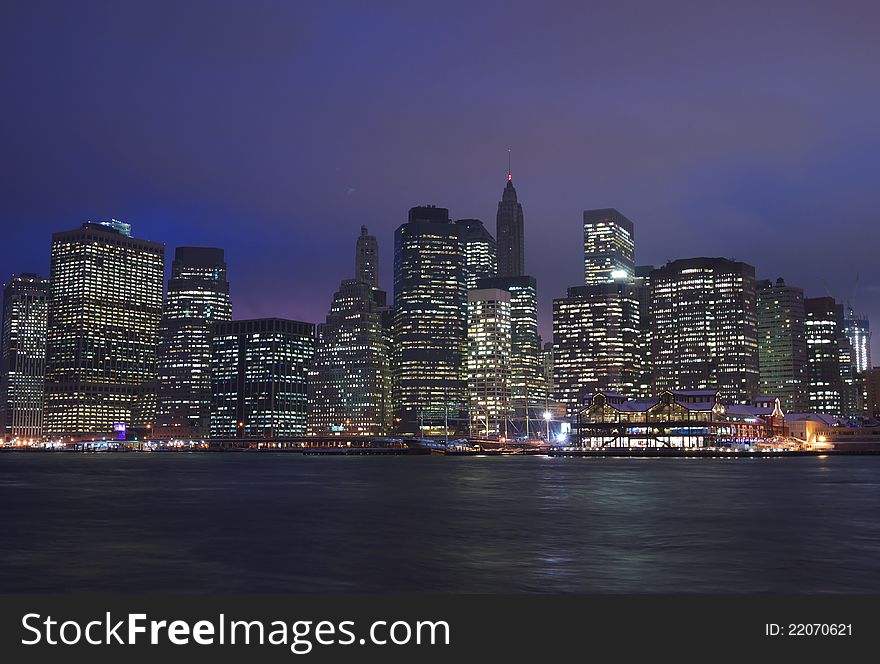 A view of downtown Manhattan from Brooklyn Heights, including the financial district and South Street Seaport on a clear evening. A view of downtown Manhattan from Brooklyn Heights, including the financial district and South Street Seaport on a clear evening.