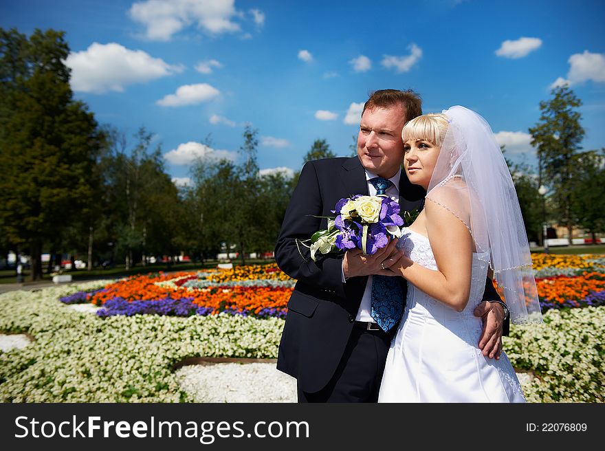 Happy groom and bride wedding walk in the park. Happy groom and bride wedding walk in the park