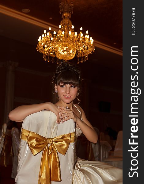 A portrait of a beautiful happy bride indoor