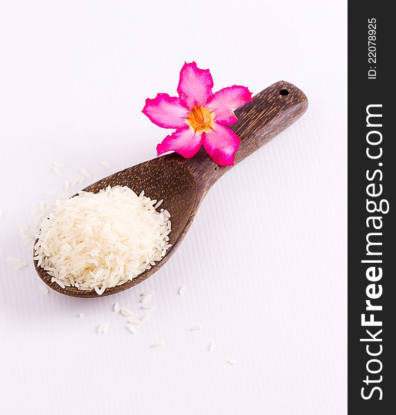 Raw rice and wooden spoon