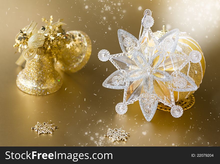 Christmas ball, bell and decorations on a gold background. Christmas ball, bell and decorations on a gold background
